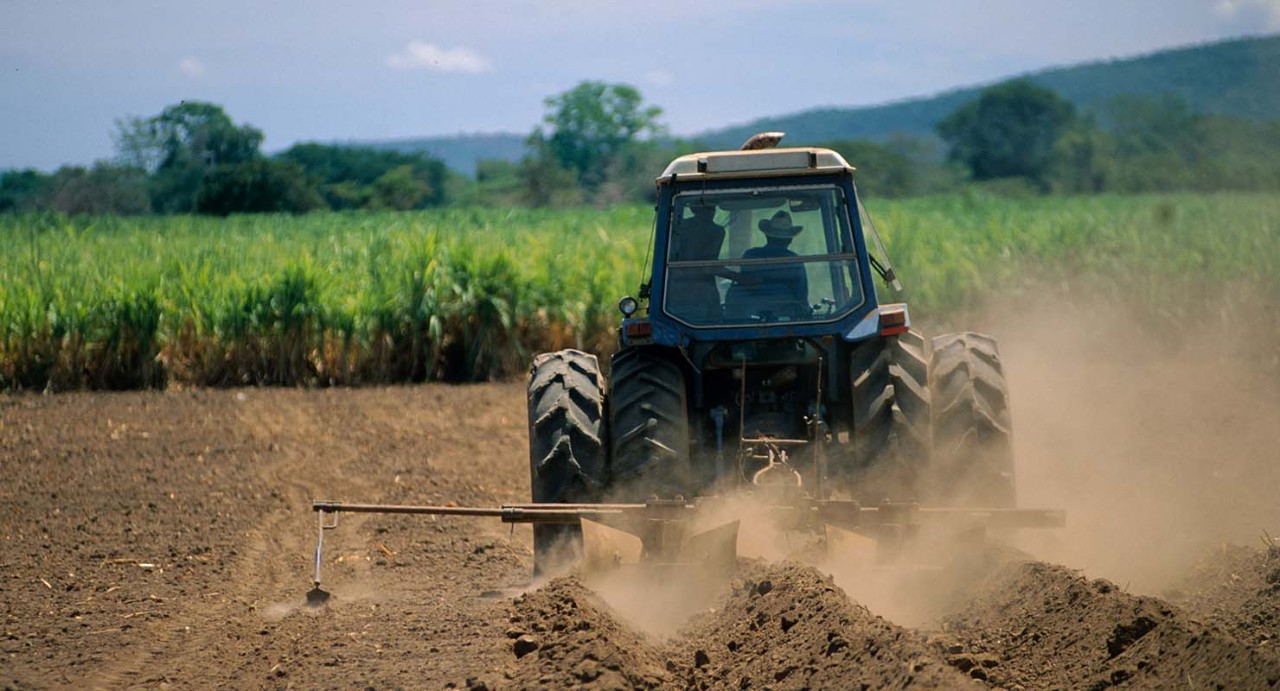 Tractor plowing soil